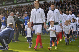 Darren Fletcher of West Bromwich Albion leads the teams out wearing retro kit and tracksuits on Jeff Astle Day celebrating the WBA legend.