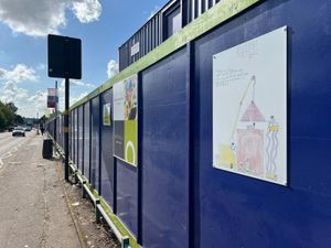 Pupils were able to view their designs from a recent poster competition displayed on the site hoarding for the first time 