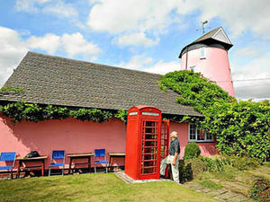Supporting image for story: Pink windmill home is no longer for sale