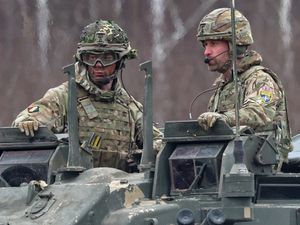 The Prince of Wales arrives in a Challenger 2 battle tank to attend a field training field at Tapa Camp