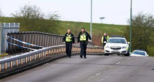 Police on the bridge after the suicide of David Stokes