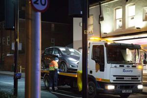 A car is towed away from the scene. Photo: Kennett Photo