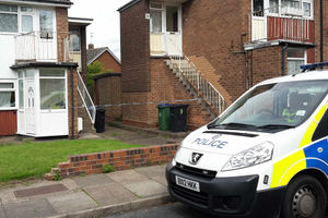 Police at the scene in Chapel Street, West Bromwich, where Wendy Mann was found