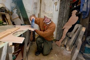 Graeme Perks gets to work cutting out the soldier silhouettes