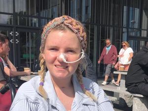 Handout photo of Summer Clarke smiling, wearing a nasal tube