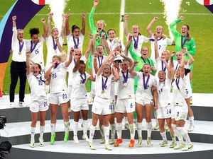 England’s Leah Williamson and Millie Bright lift the Euro 2022 trophy