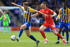 Matthew Pennington of Shrewsbury Town and Will Keane of Wigan Athletic (AMA)