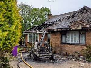 Supporting image for story: Two people taken to hospital after 'severe' blaze damages house and car