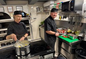 Leila and Vali prepare for the first customers