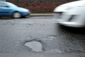 Supporting image for story: Fill the potholes first - money better spent than on car charging points