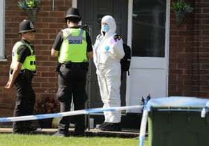 Police at the scene the day after the fatal stabbing