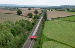Dramatic aerial pictures capture the scene of the collision where a passenger train crashed into a tractor and trailer near to Nordan Farm, in Leominster, Herefordshire.