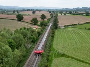 Supporting image for story: Aerial footage shows aftermath of horrific train collision with tractor trailer at level crossing
