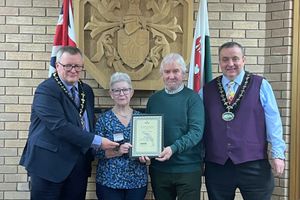 Mair and Roy Wilson receiving their awards