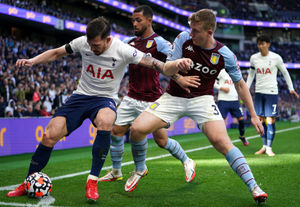 Tottenham Hotspur's Pierre-Emile Hojbjerg (left) holds the ball from Aston Villa's Matt Targett