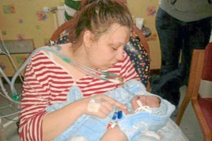 Katyia nursing little Lucian during the short time she had with him