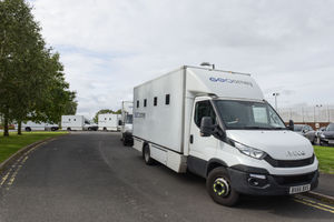 Prisoner transportation vehicles lined up outside HMP Brinsford