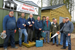 Oswestry Men's Shed aims to look after the wellbing of older men. Here, members outside their shed at the showground