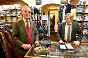 Nigel Farage buys a flat cap at Halon Menswear in Shrewsbury