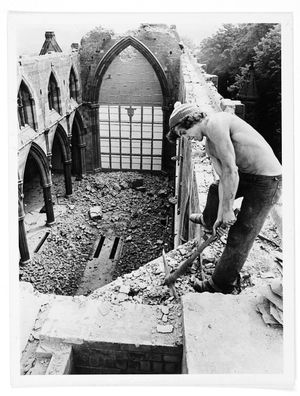 The demolition of St Michael's Church, Stourport, in July 1979. The church was being demolished to make way for a new building. The photograph shows David Beard working above the alter where the roof once was.