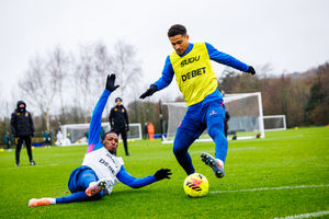 Joao Gomes rides a tackle in Wolves training (Photo by Brett Patzke - WWFC/Wolves via Getty Images)