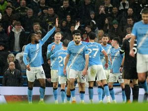 Erling Haaland, second left, celebrates after scoring his side's third goal