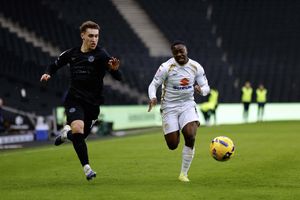 Iwan Morgan competes with Aaron Nemane during the game between MK Dons and Shrewsbury Town