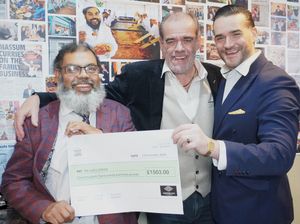 (Left) Abdul Salam owner of Lichfield's Eastern Eye presents a cheque for £1503 to We Love Lichfield Simon and James Price