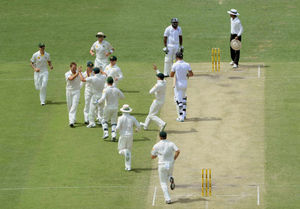 Australia's Ryan Harris (second left) celebrates taking the wicket of England's Kevin Pietersen (centre)