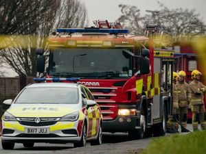 Supporting image for story: Tractor and 'several hay bales' destroyed by fire