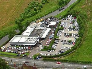 Supporting image for story: Mini dealer faces legal action over flood-plain car park