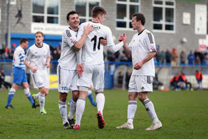Adam Farrell of AFC Telford United celebrates with Matty McGinn and Shaun Whalley
