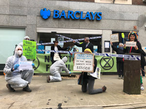 Supporting image for story: Climate activists in 'theatrical' protest outside Oswestry Barclays