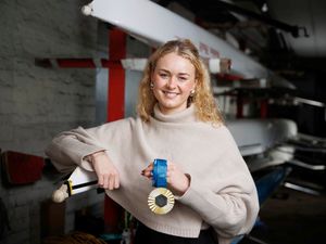 Hannah Scott showing off her Olympic gold medal