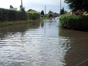 Supporting image for story: Wem streets under water in downpour