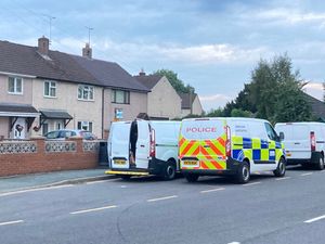 Police and forensic vans in St Martins