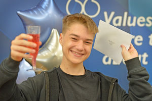 Tomass Jereminovics toasts the future as he holds his results