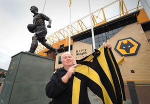 Merv with a short believed to date back to the 1908 FA Cup final and later presented to Billy Wright 
