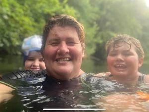 Fran Pearson wild swimming with her children Penny Jones-Parry, aged 13, and Dominic Jones-Parry, aged 12