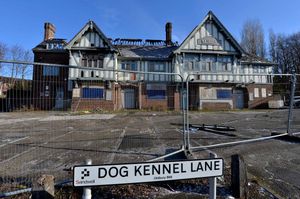 The pub is surrounded by shops and housing