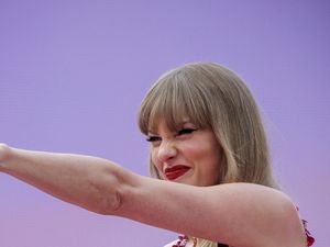 Supporting image for story: Taylor Swift wears T-shirt saying ‘A lot going on at the moment’