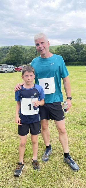 Dave and Brenin Hughes taking first and second in the Trail Run
