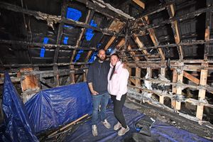 Emma and Jon Logan in the burnt-out loft. Photo: Tim Sturgess