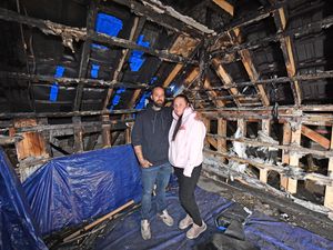 Emma and Jon Logan in the burnt-out loft. Photo: Tim Sturgess