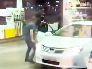 Supporting image for story: Watch: Terrifying moment driver is targeted by machete gang at petrol station