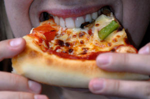 File photo dated 29/08/07 of a person biting into a slice of pizza. Issue date: Monday August 4, 2025.
Copyright holder: Steve Parsons/PA Wire
Copyright notice: © 2025 PA Media, All Rights Reserved
Usage terms:
FILE PHOTO
Picture by: Steve Parso
