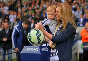 Two-year-old grandson Joseph Jeffrey places the match ball onto the plinth on Astle Day