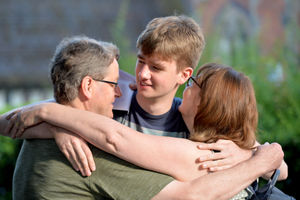 Robbie Strang gets a hug from his parents Martin and Rachel at Stafford Grammar after he gained 3A*s