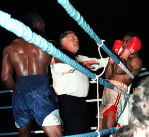 the referee stopping the WBO Super Middleweight fight between Michael Watson (right) and  Chris Eubank at Tottenham's White Hart Lane