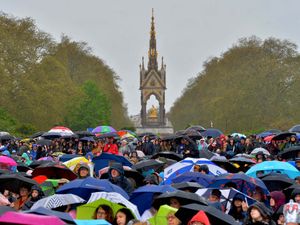 Supporting image for story: King Charles coronation: How thousands braved the weather to mark the occasion in style